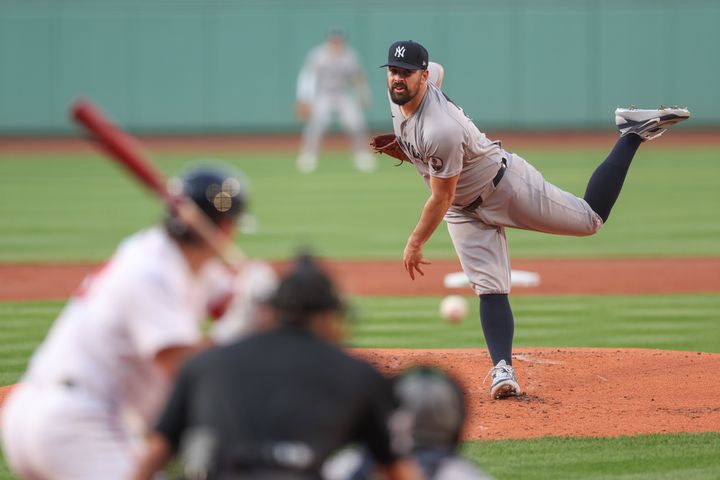 Yankees starting pitcher Carlos Rodon (55) delivers a pitch during the first inning against the Boston Red Sox at Fenway Park