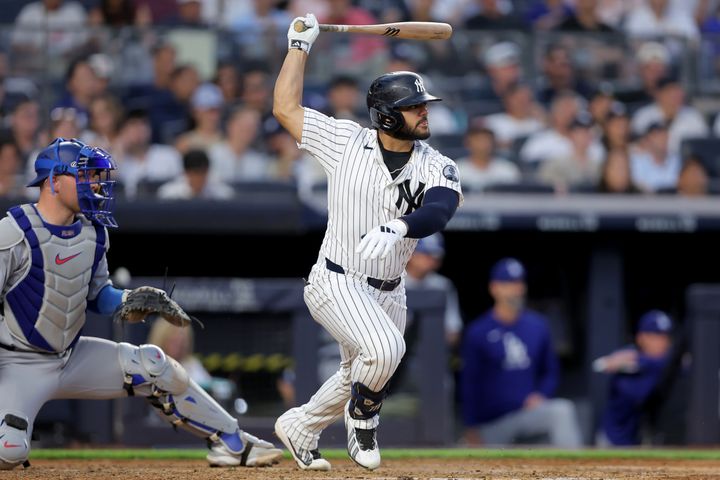 Yankees right fielder Jasson Dominguez (24) follows through on a double against the Los Angeles Dodgers during the fourth inn