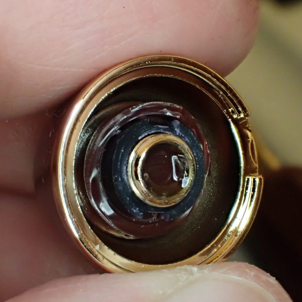 Close-up of the inside of the top finial showing the sheared plastic