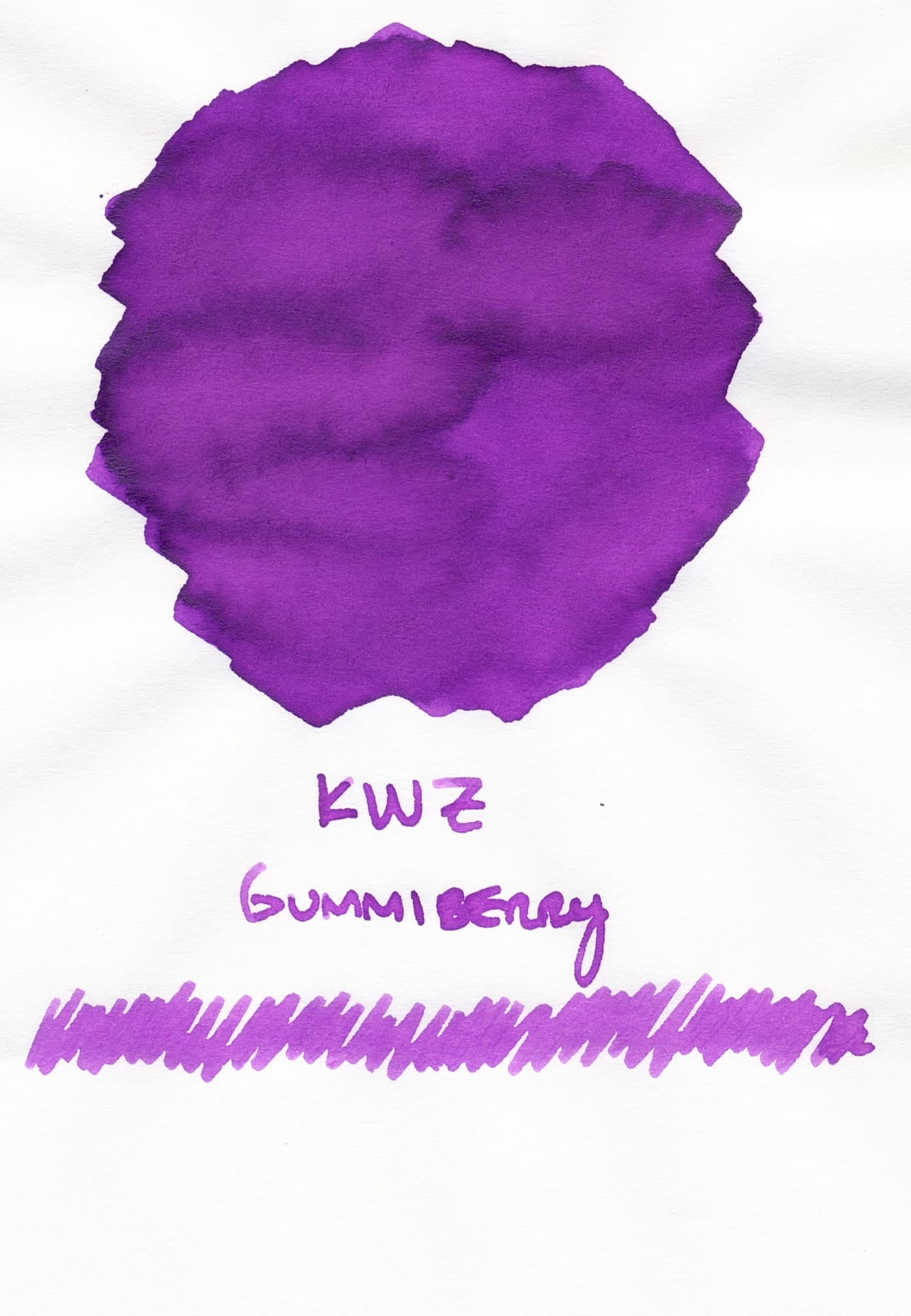 Fountain pen ink swatch of a bright, medium violet ink labeled "KWZ Gummiberry" and a squiggle underneath the label spanning almost the full width of the scan