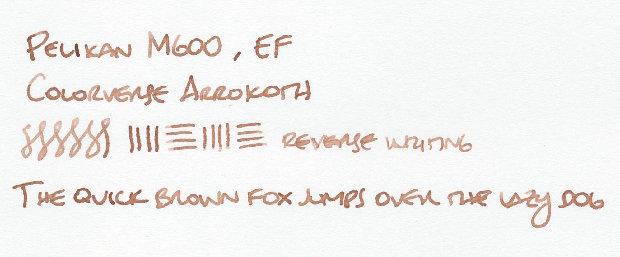 Writing sample using the brown fountain pen ink: "Pelikan M600, EF; Colorverse Arrokoth; test figure-8s and lines; 'reverse writing' written with the reverse side of the nib; The quick brown fox jumps over the lazy dog"; 