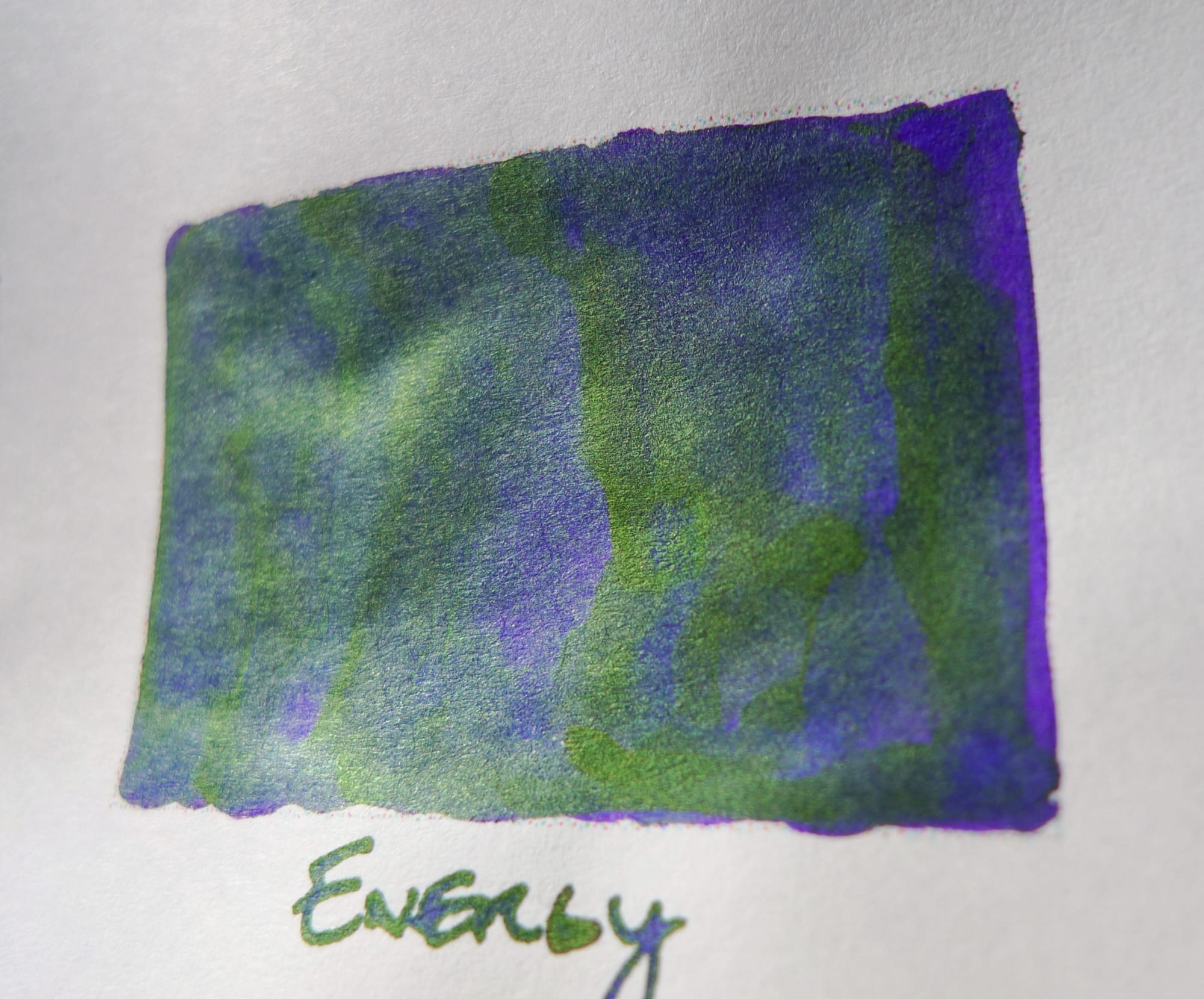 Deep blurple ink swatch with subdued green sheen seen at an angle in sunlight to emphasize the sheen