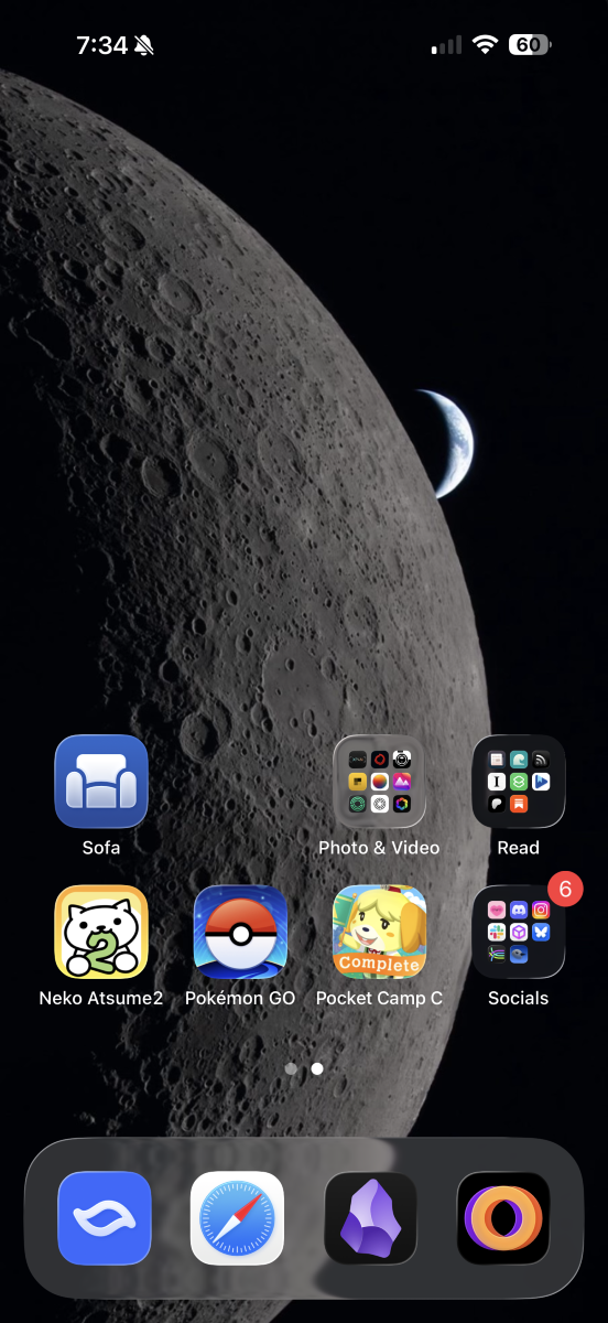 Screenshot of an iPhone homescreen with a wallpaper of the moon in the foreground and a crescent Earth in the background; 2 rows of app icons and folders placed above the dock