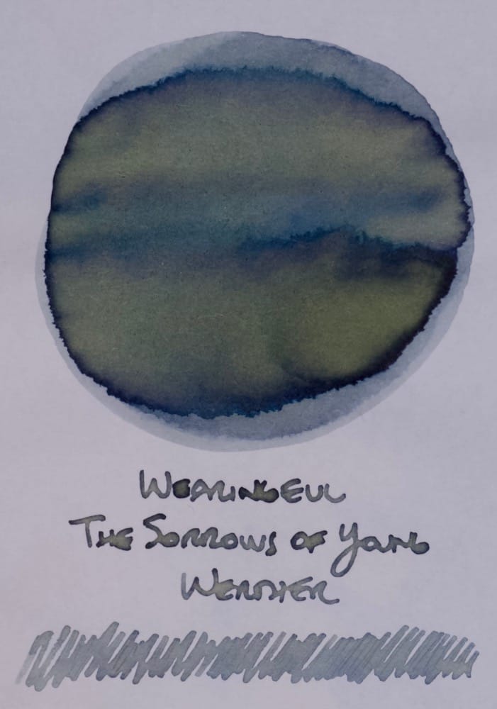 Ink Swatch of a blue-gray ink with some yellow-green multishading
