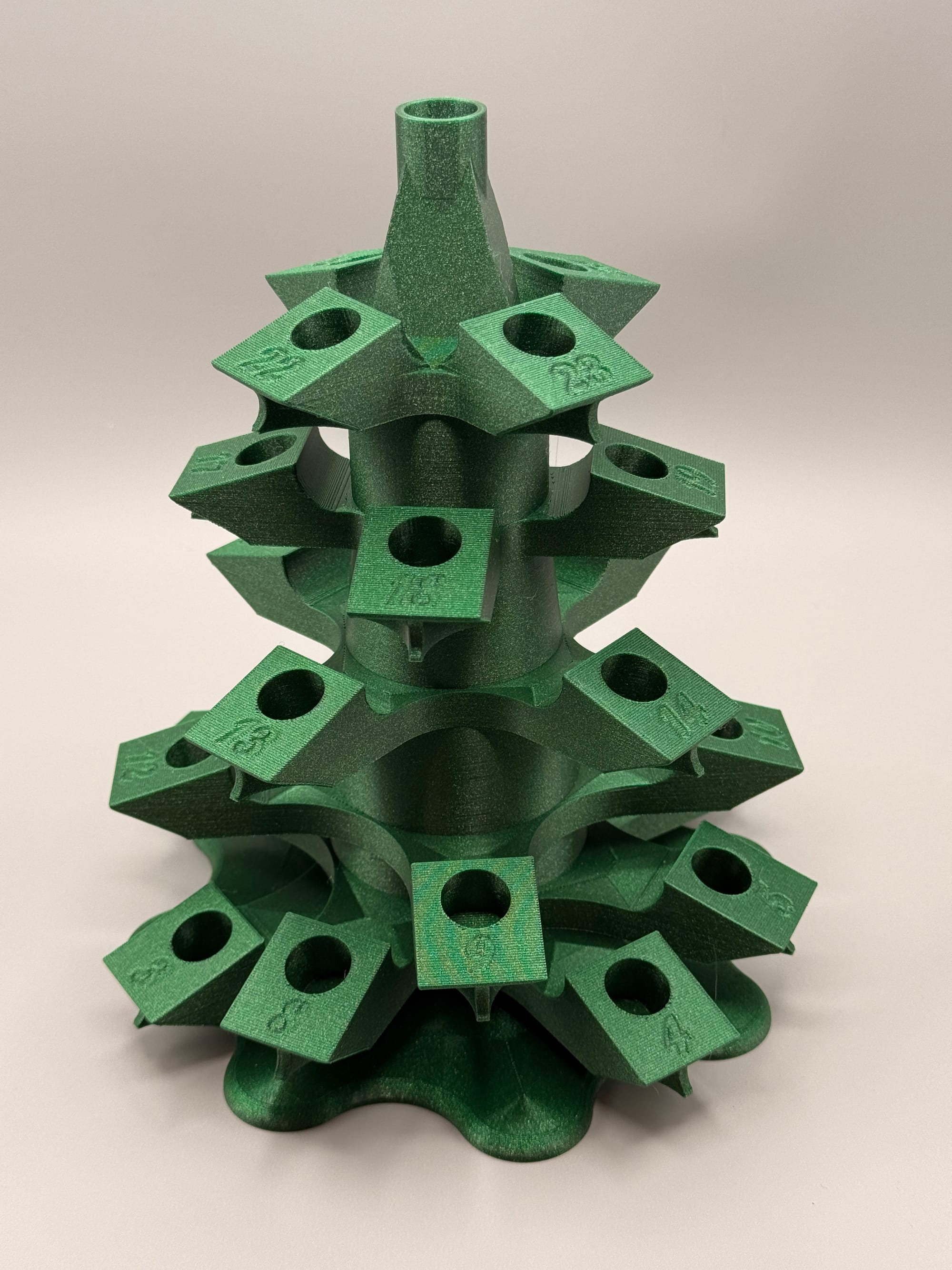 Green, 3D-printed rotating, tree-shaped stand with numbered receptacles for 5 mL plastic vials