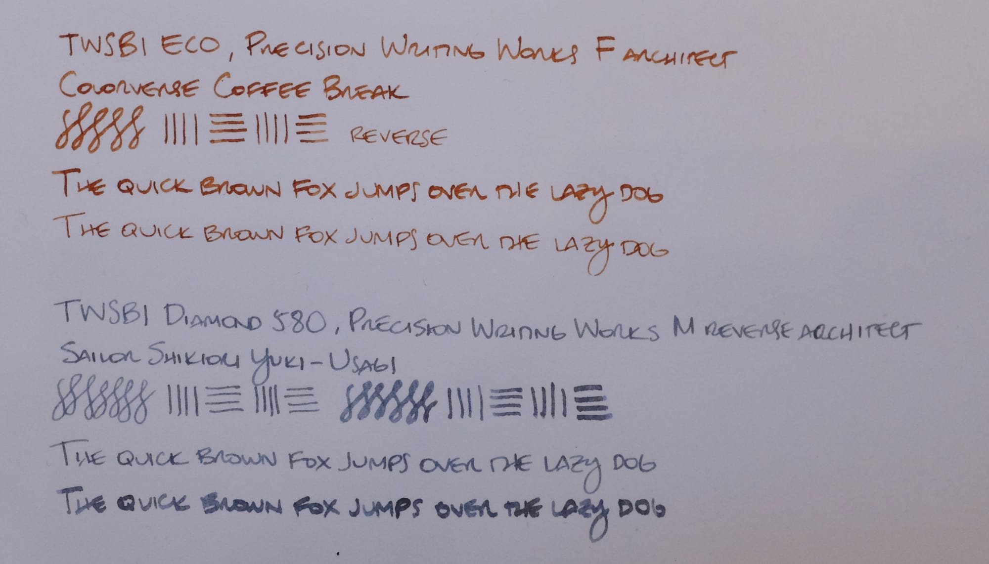 Writing samples from both fountain pens, one in brown ink, the other in blue-gray ink