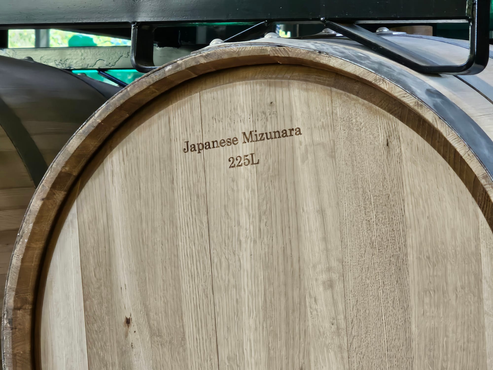 Close view of a barrel marked Japanese Mizunara, 225L