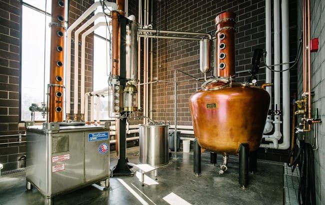 Copper stills and distilling equipment inside Dented Brick Distillery in South Salt Lake, Utah.