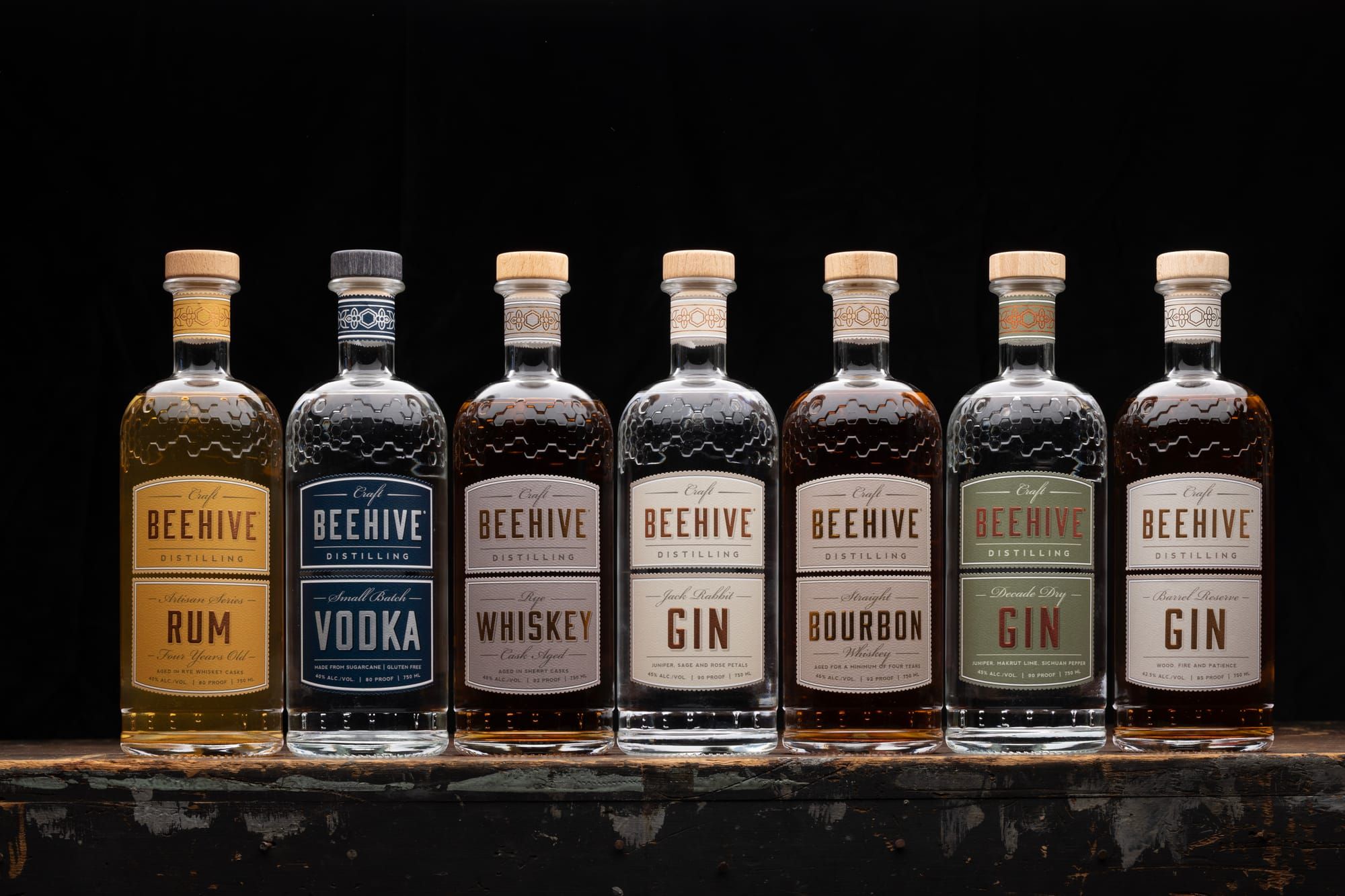 Beehive Distilling spirits photographed together.