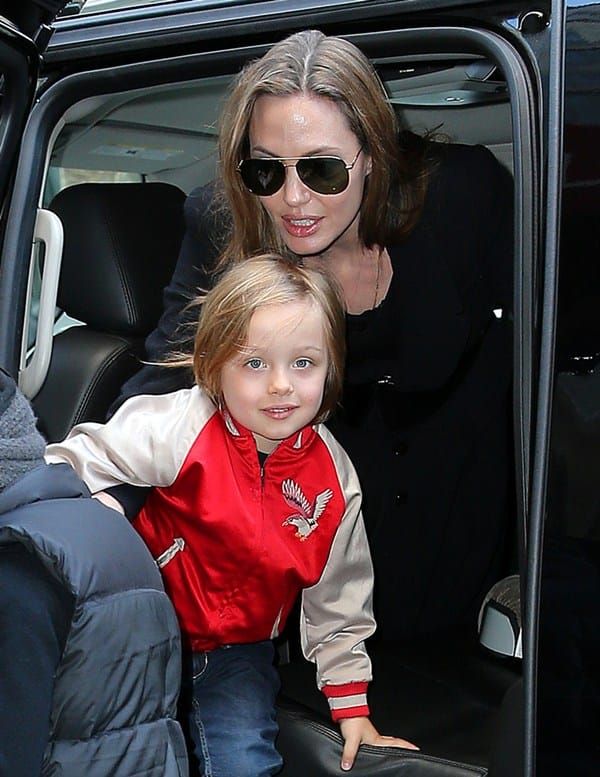 The Jolie, some kids, the ring, and a stuffed toy