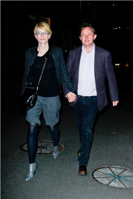 Her glasses match his jacket