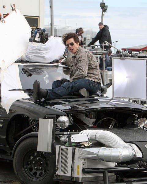 Tom on top of a car