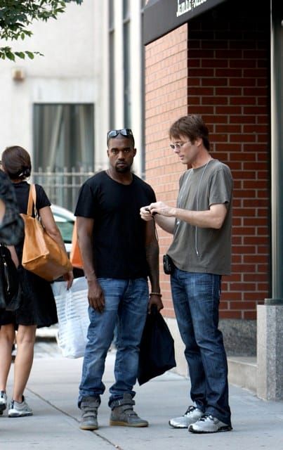 Kanye is…smiling