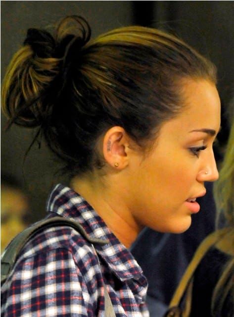 Miley’s ear tat
