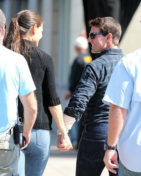Tom runs, holds hands