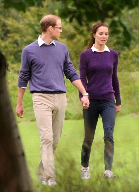 The coordinated Cambridges hold hands, look tired