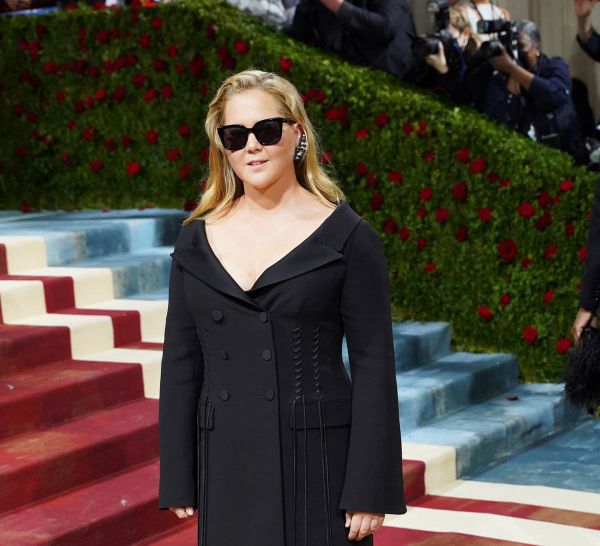 Amy Schumer and Christine Baranski in black