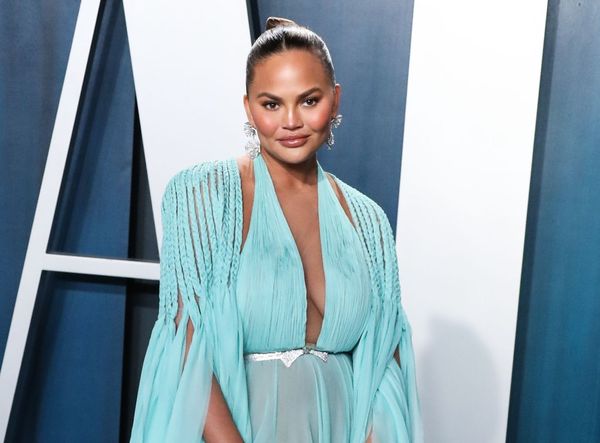 Chrissy Teigen Pokes Her Head Up
