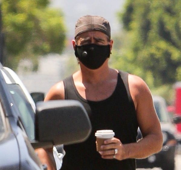 Colin Farrell: tank top, masks, and books