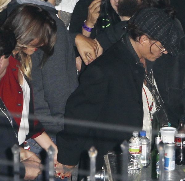 Johnny & Amber holding hands