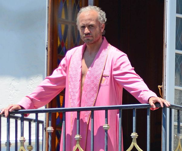 Versace in a pink robe