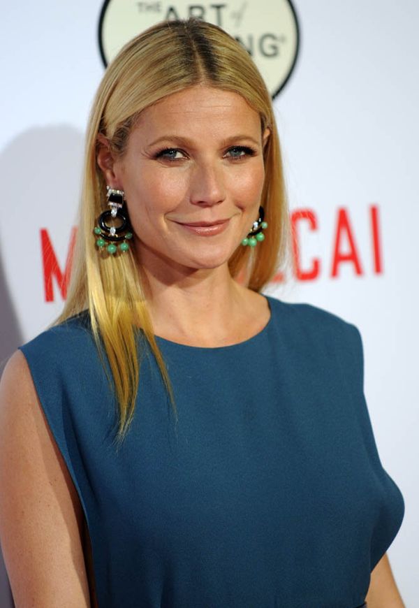 Gwyneth and Brad holding hands