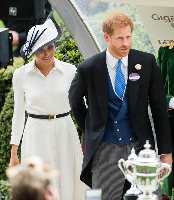 Prince Harry and Royal Meghan present a trophy
