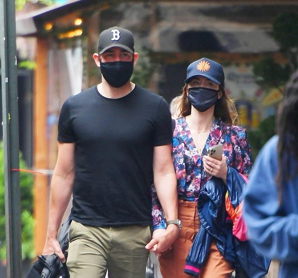 Emily and John hold hands in New York