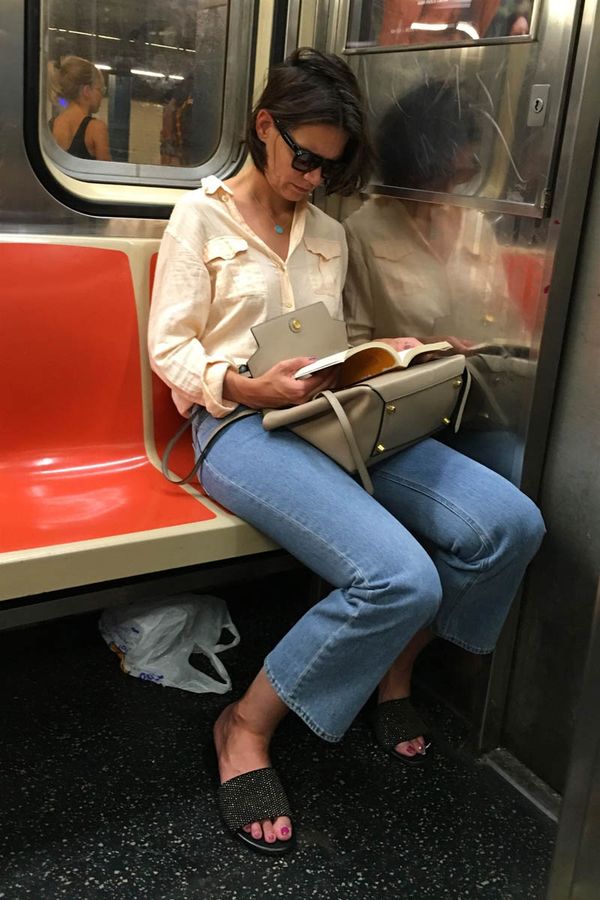 Katie reads on the subway