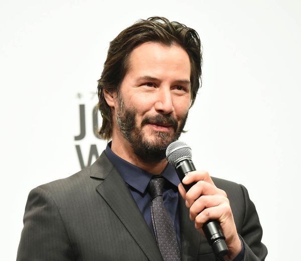 Keanu travels with his girlfriend