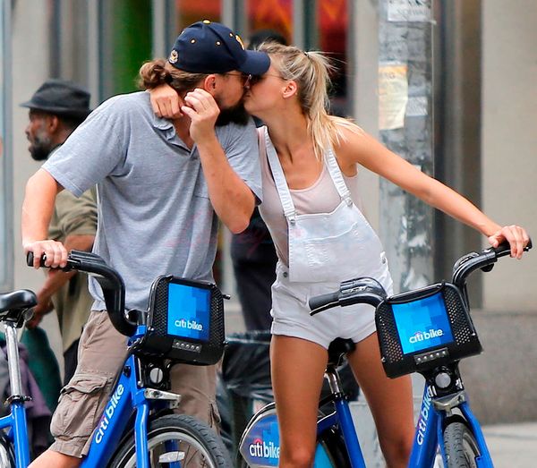 Leo kissing a blonde on a bike