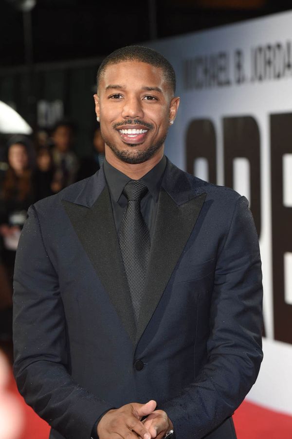 Michael B Jordan plays with puppies