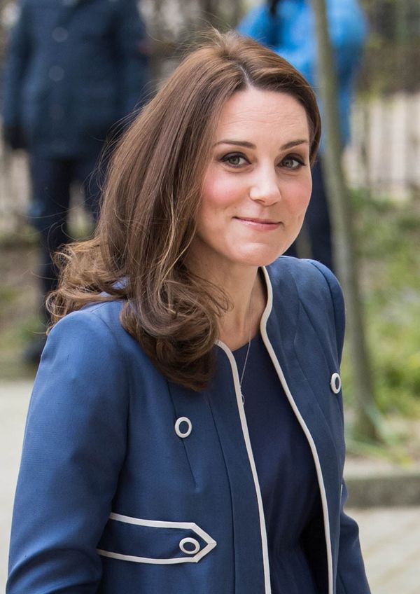 Princess Kate smiles in blue