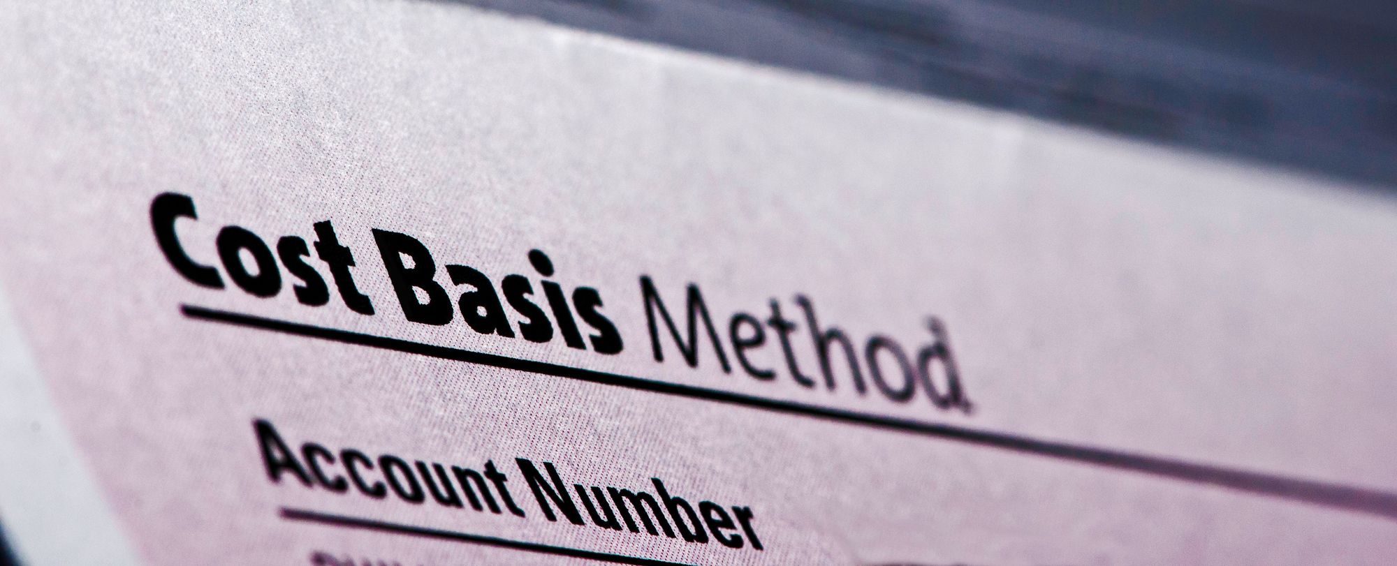 closeup of a paper with “cost basis method” typed on it
