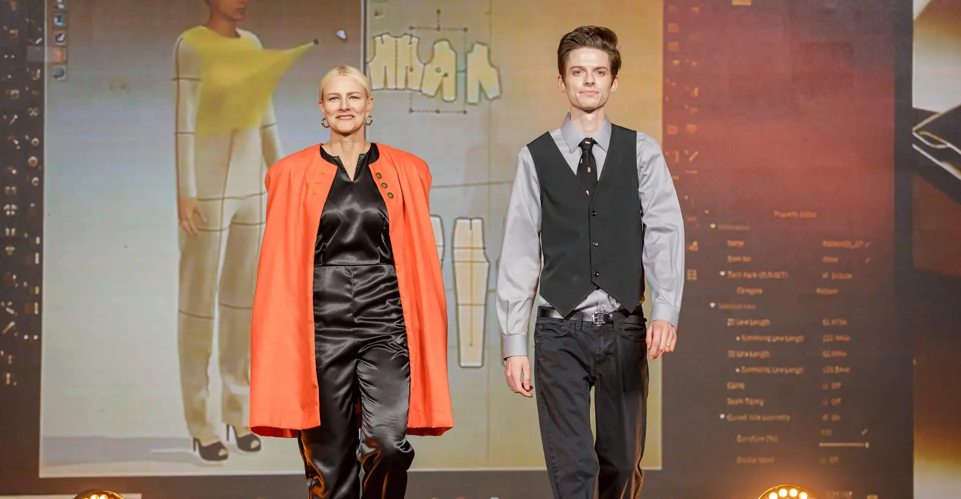Carson and OSU's President walking the runway in one of his designs