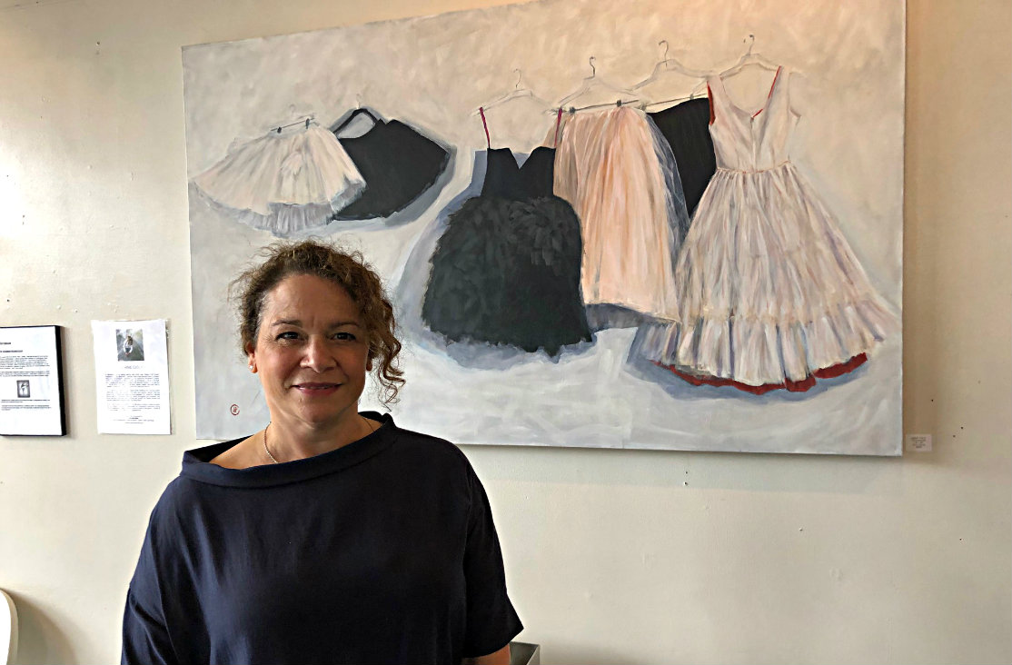 Joanie Ciolfi in front of her painting, "The Rehearsal."