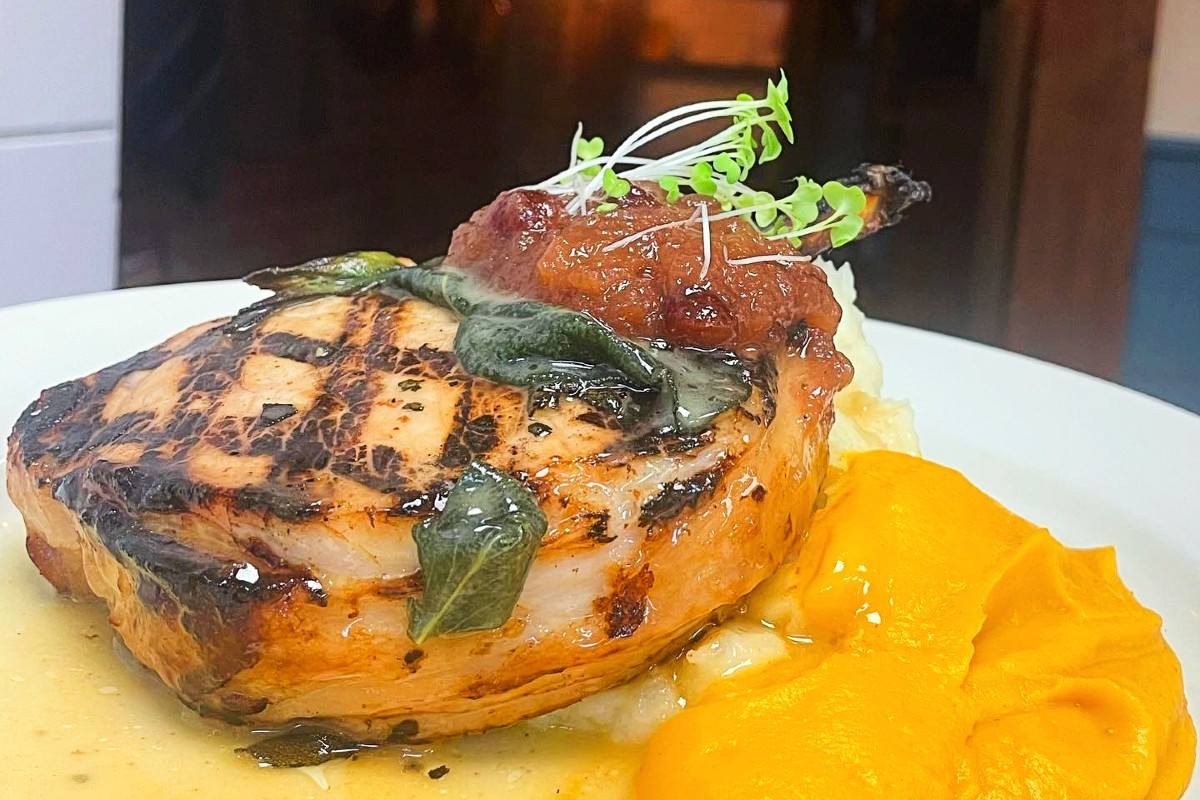 Apple cider brined porch chop in butter and sage with butternut squash and apple chutney. Photos courtesy of Gepeetto Osteria e Bisteccheria