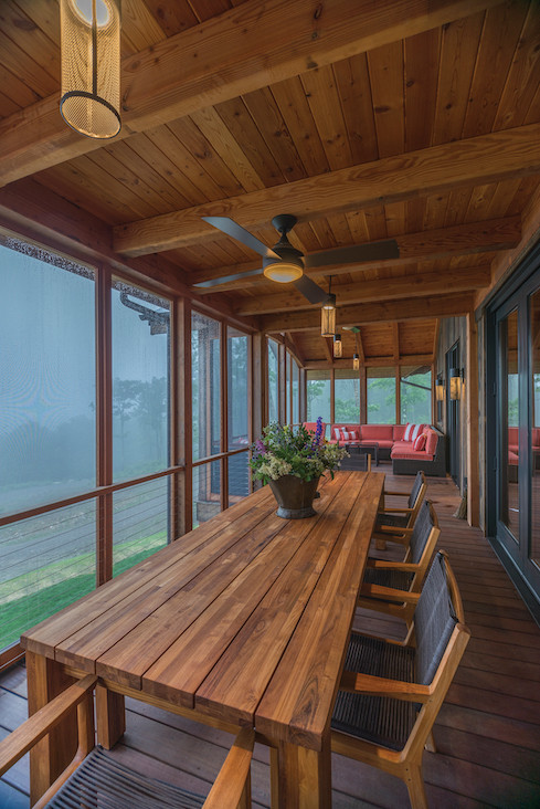 The screened and covered porches are intended to blur the line between interior and exterior spaces.