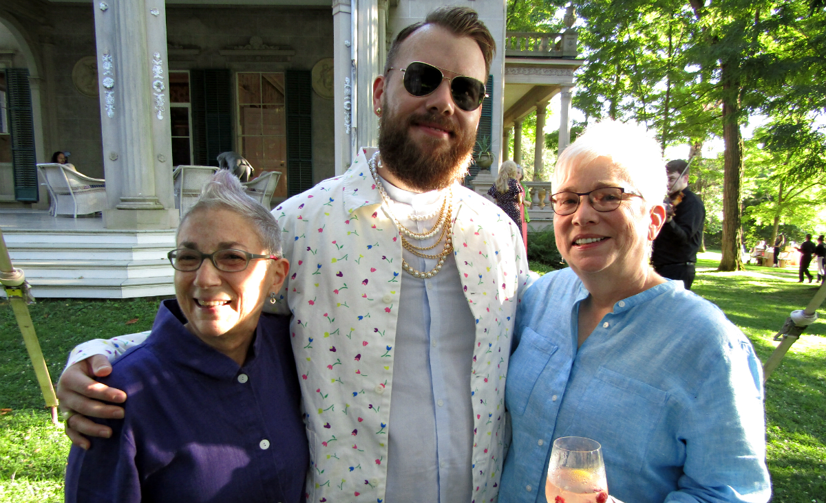 Susan Simon and Beth Jones flank Caleb Hammons, the Fisher Center's senior producer