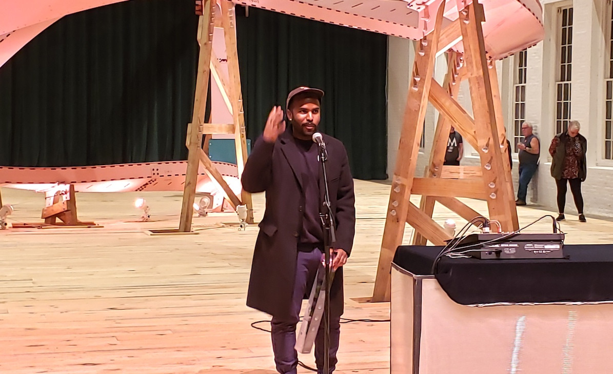 EJ Hill speaks to the crowd.