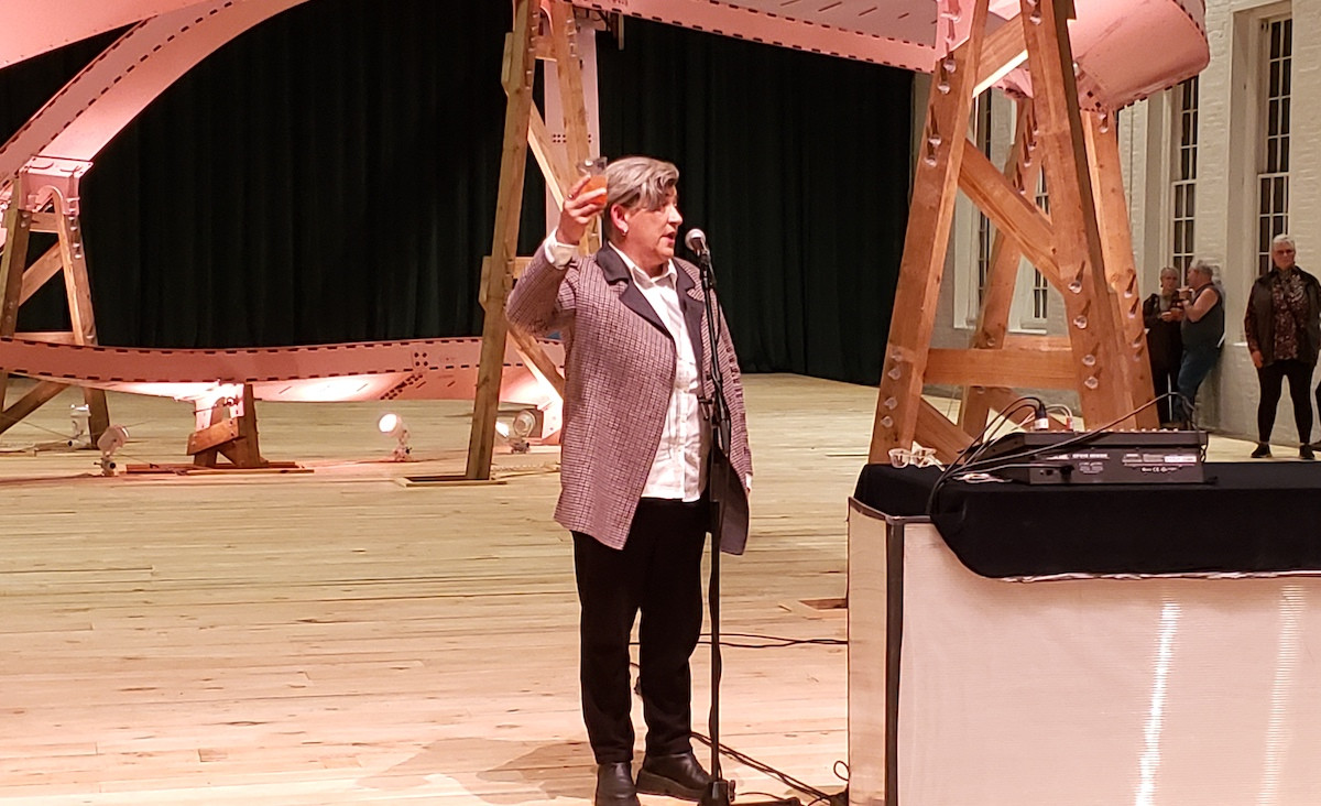 MASS MoCA Director Kristy Edmunds leads the crowd in a toast to joy.