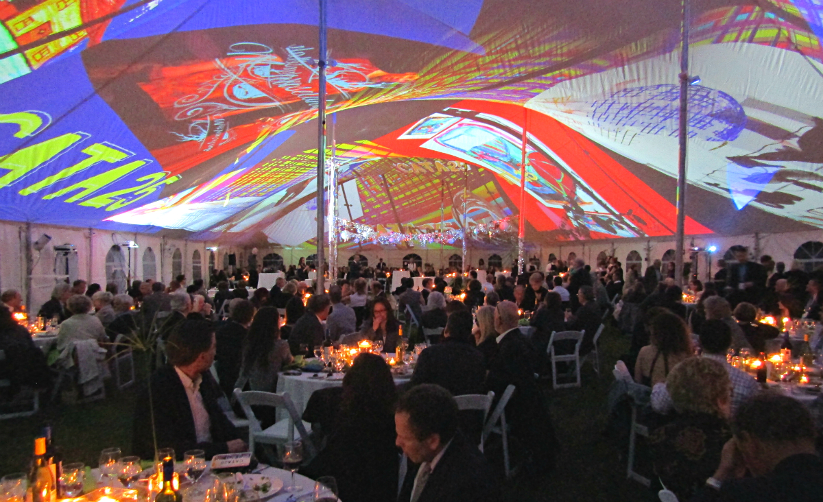 Candlelight and colorful projections from Joe Wheaton set the scene for dinner and dancing. Candlelight and colorful projections from Joe Wheaton set the scene for dinner and dancing.