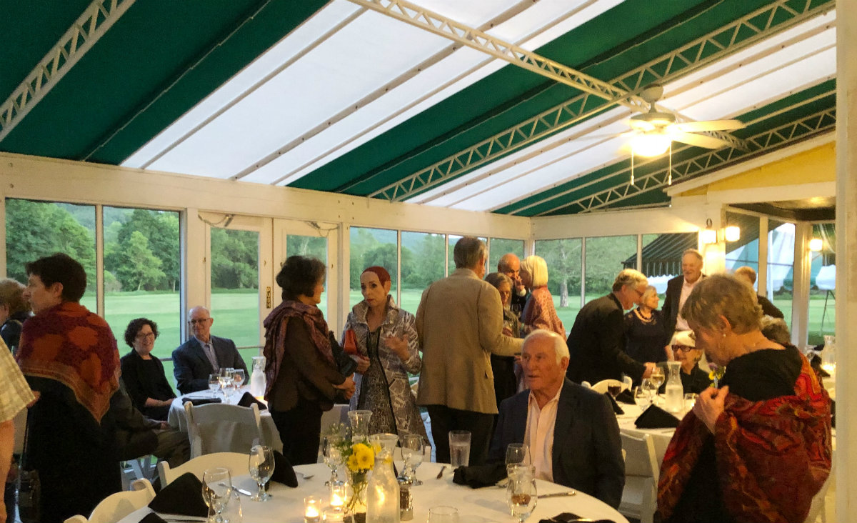Patrons and the evening's performers mingled in the clubhouse and screened-in porch before dinner.