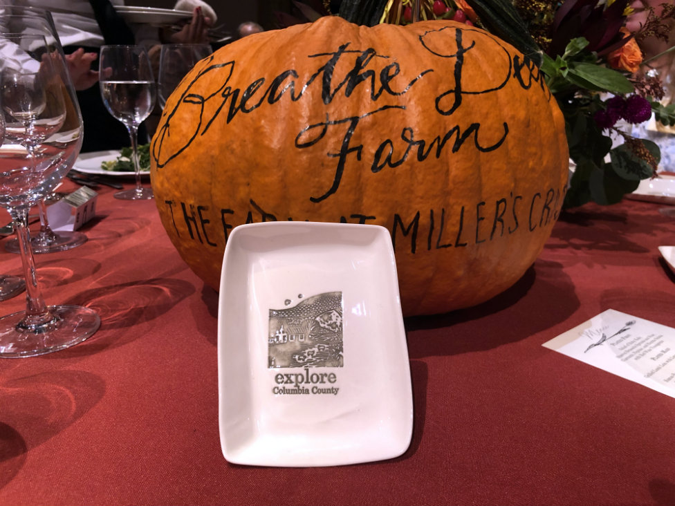 Centerpiece punctuated by a custom-made dish from porcelain artist Mary Anne Davis