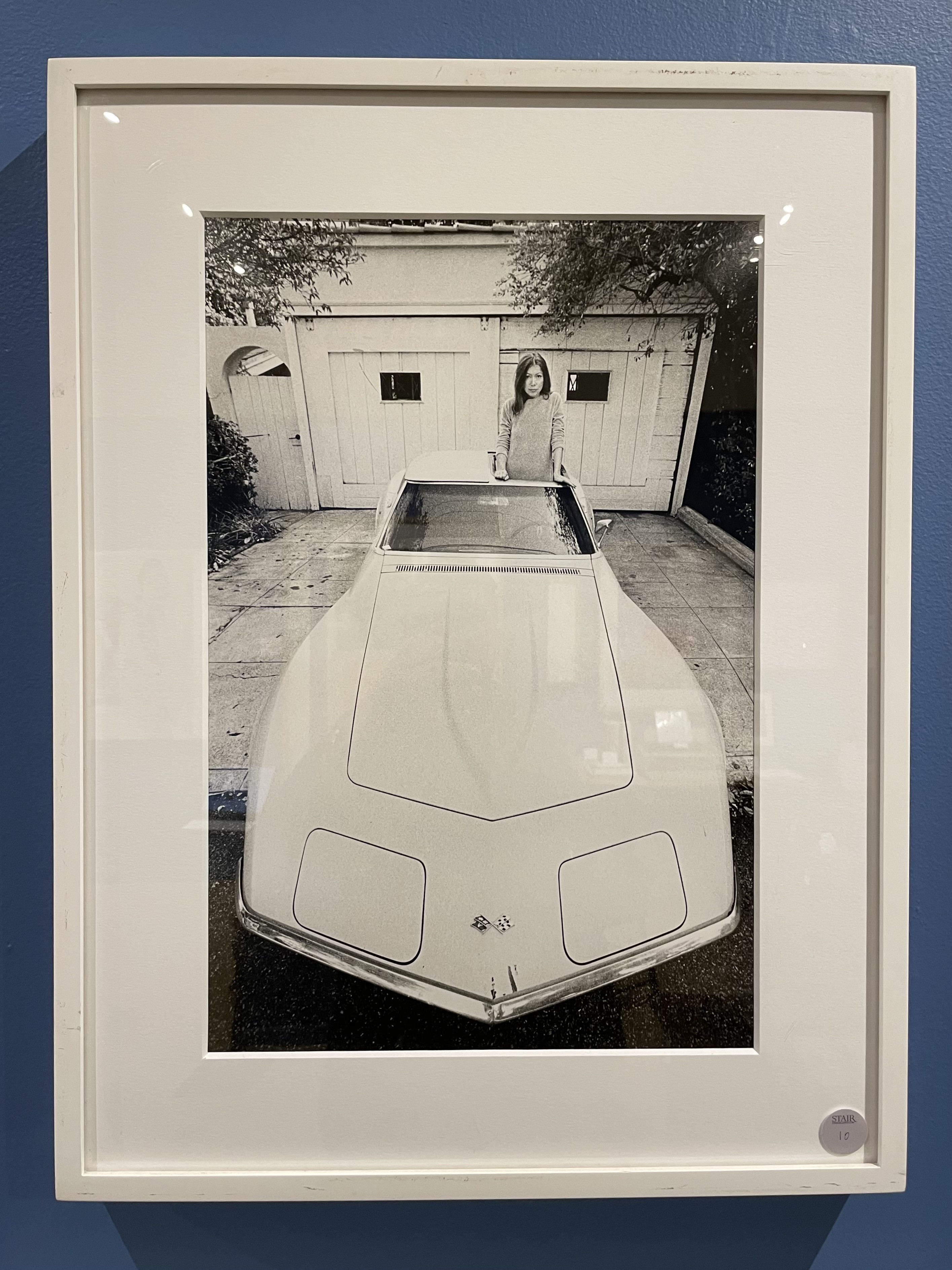 Joan Didion Standing in Her Stingray Corvette, by Julian Wasser