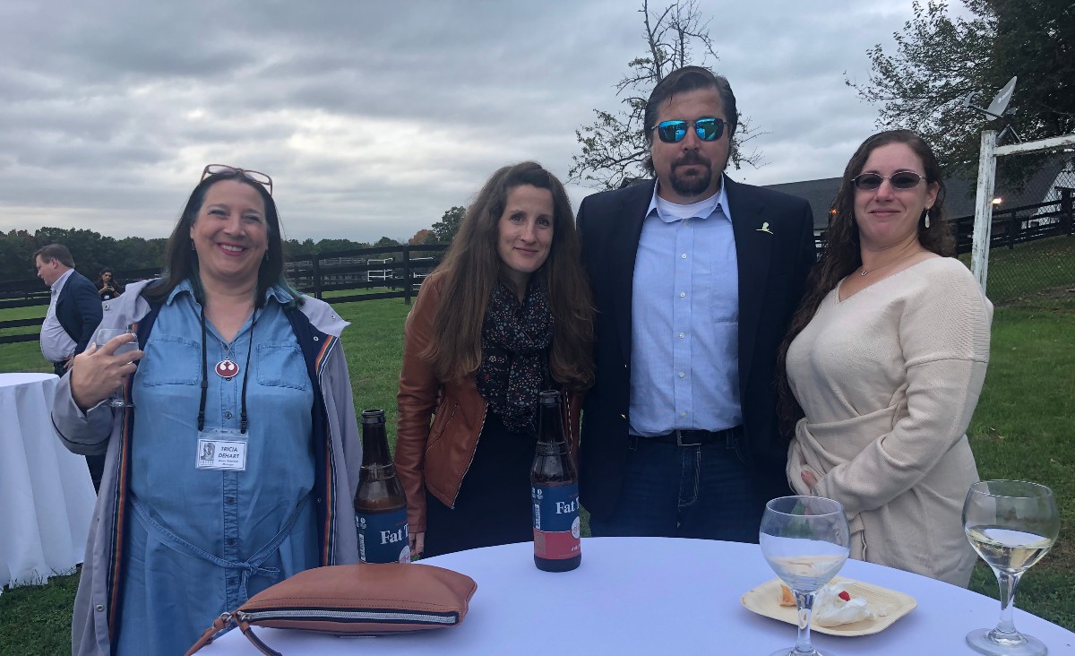 Tricia Dehart, donor relationship manager; Morgan O'Brien, Rick Burke of Irish Hill Century Farm, and Melissa Murray, the equine care manager.