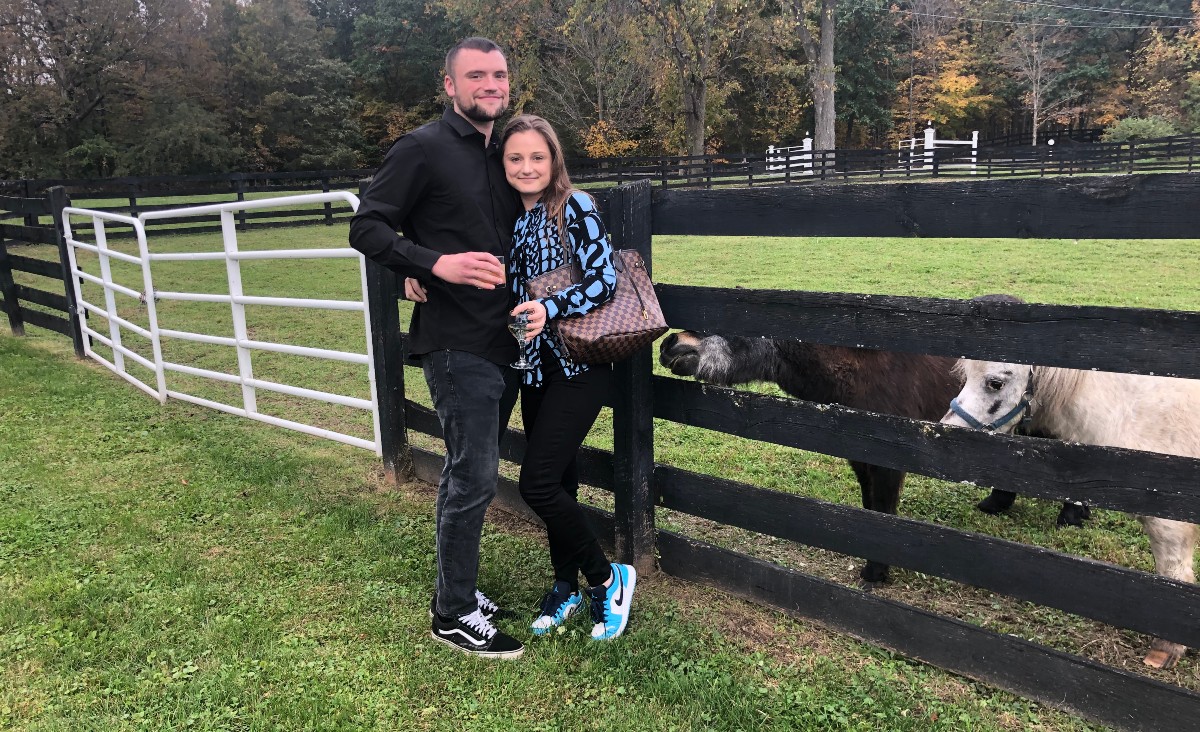 Matt Nussbaumer and Weronika Kierach say hello to Rain Man, a miniature horse who is EA's official greeter&nbsp;and one of the sanctuary's original founding horses;&nbsp;and Rocket Man, a miniature Appaloosa.