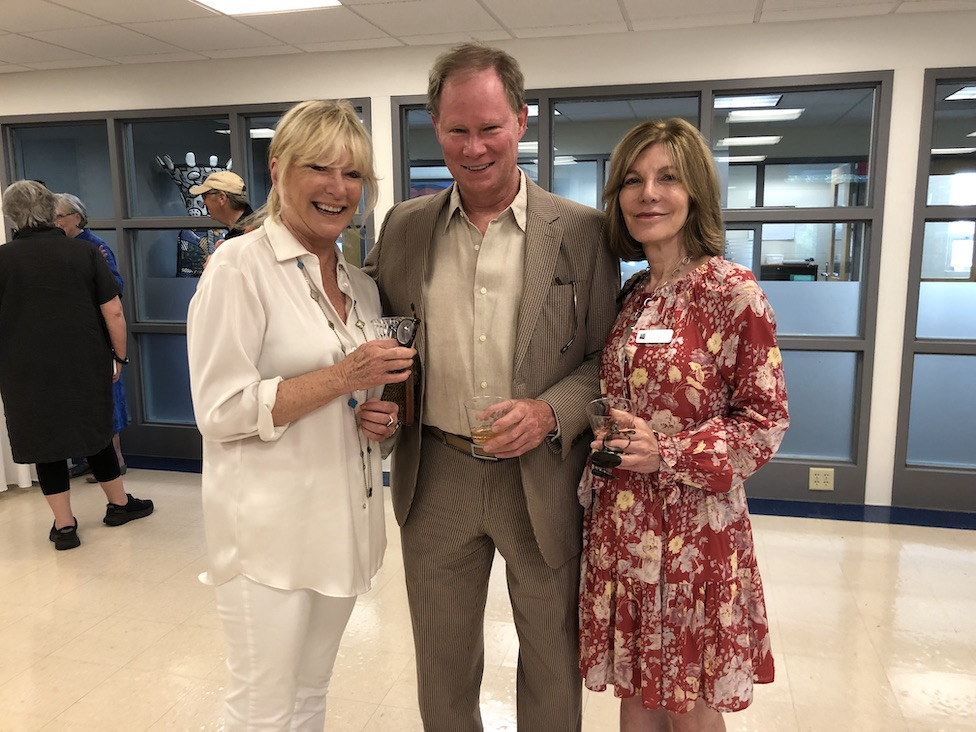 Gallerist Jane Eckert with Mark Delocure and Lisa Coleman, who is on the center's board of directors