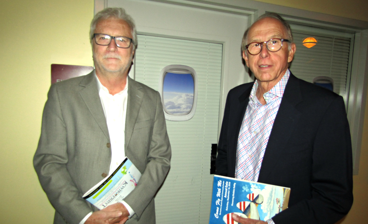 Michael Bandzierz and Steve McAlister take in the view from the airplane windows Michael Bandzierz and Steve McAlister take in the view from the airplane windows