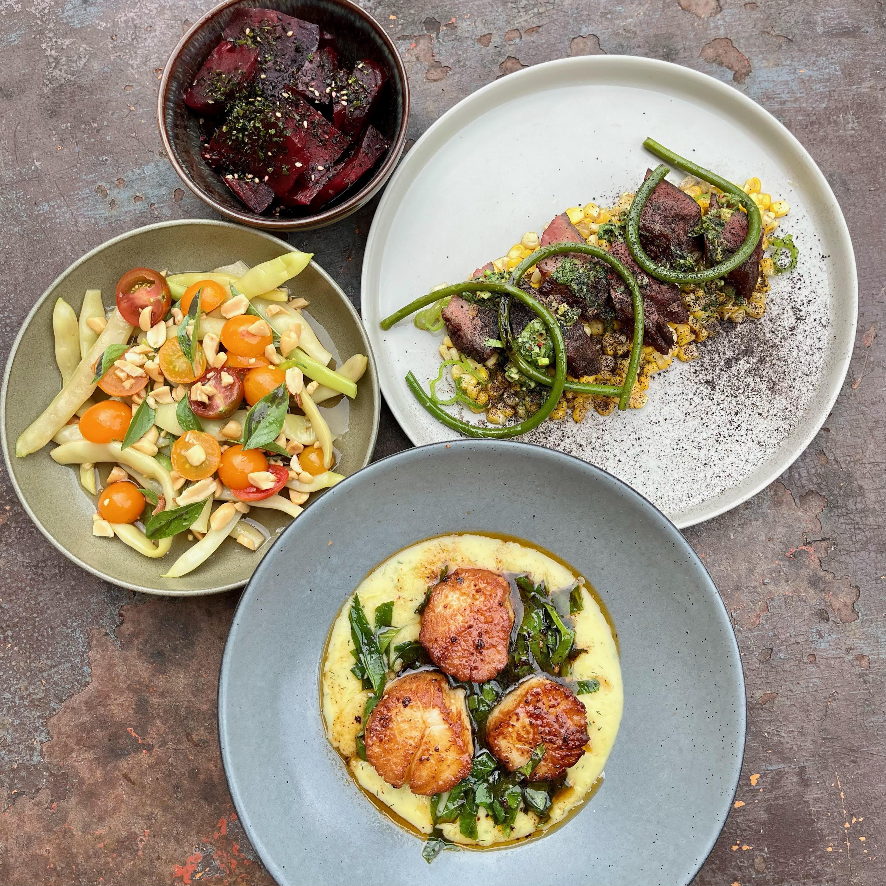 Marinated beets, duck breast with corn and chimichurri, seared scallops with chowder sauce and nduja butter, romano beans with cherry tomatoes Marinated beets, duck breast with corn and chimichurri, seared scallops with chowder sauce and nduja butter, romano beans with cherry tomatoes